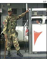 Soldiers patrol a petrol station in Maracaibo, western Venezuela