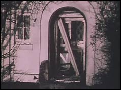 Front door with debris lying across it