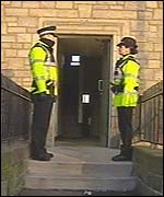 Police officers outside one of the flats