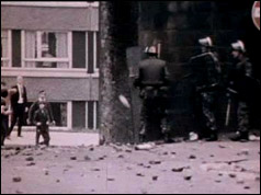 Photograph of British troops facing up to angry residents in Londonderry