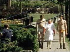 Dutch police bring a mentally-handicapped woman to safety dressed only in their underwear to show they are not armed