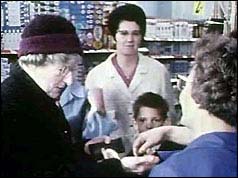 Shoppers using the new coins