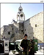 Church of the nativity with jeeps outside