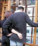 Couple at estate agent window