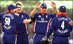 James Anderson is congratulated by team-mates