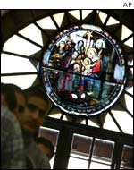 A few Palestinian Christians attend mass at the Church of the Nativity