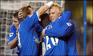 Eidur Gudjohnsen is congratulated on opening the scoring for Chelsea after 43 minutes at home to Aston Villa