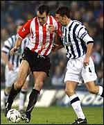 Gavin McCann (left) of Sunderland and Derek McInnes of WBA 