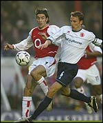 Middlesbrough's Gareth Southgate holds off Robert Pires