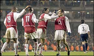 Arsenal celebrate topping the table at Christmas for the first time in Premiership history 