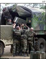 French troops load mortars and equipment on trucks 