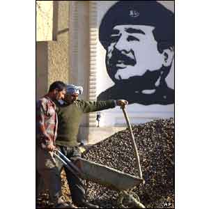 Iraqi workers outside the Al-Fidaa company in Baghdad, inspected on Saturday