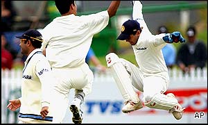 Indian fast bowler Asish Nehra celebrates with Parthiv Patel