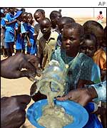 Schoolchildren getting food aid