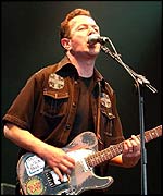 Joe Strummer and the Mescaleros performing live on stage at the Fleadh 2002 Music festival