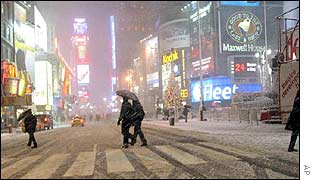 People struggle to hold on to their umbrellas in New York City