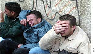 Palestinians mourn the death of Maadi Samir Abu Obeid in the West Bank city of Ramallah 26 December 2002