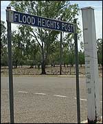 A flood marker post