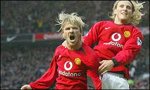Manchester United's Diego Forlan celebrates his goal with team mate David Beckham 