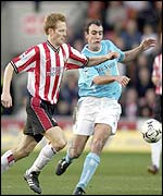 Southampton's Michael Svensson and Sunderland's Gavin McCann 