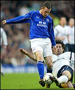 Bolton's Ivan Campo tackles Everton's Wayne Rooney