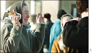 Woman crying by the site of Friday's bomb blast in the Chechen capital Grozny