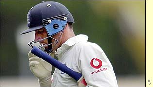 Nasser Hussain walks back to the pavilion after being caught and bowled by Glenn McGrath