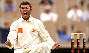 Australian spinner Stuart MacGill roars with delight after capturing the wicket of Michael Vaughan