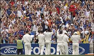 England's players leave the pitch to applause from their travelling fans