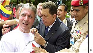 Venezuelan president Hugo Chavez signs autograph
