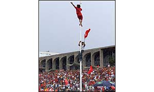People climb flagpole outside parliament [photo: AP]