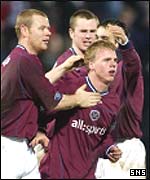 Hearts players congratulate goalscorer Graeme Weir 