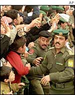 Jordanian soldiers control a crowd