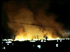 Smoke and flames erupt from the Long Kesh prison camp