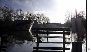 Boat on flooded river at Drongen