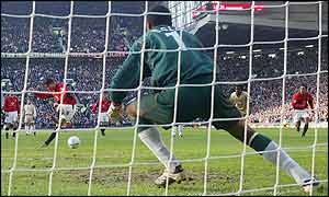 Rudd van Nistelrooy scores a penalty for Man Utd past Portsmouth's Shaka Hislop