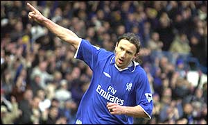 Mario Stanic holds his arm aloft after scoring for Chelsea