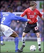 Ipswich's Fabian Wilnis presses Morecambe's Lee Elam