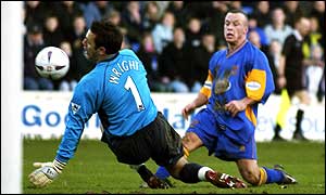 Everton's Richard Wright makes a save from Shrewsbury's Luke Rodgers