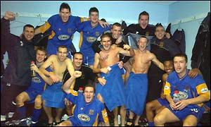The Shrewsbury team celebrate their fantastic victory over Premiership Everton
