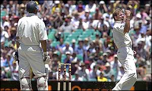 Australian bowler Brett Lee celebrates the wicket of England captain Nasser Hussain who is caught by Adam Gilchrist for 72
