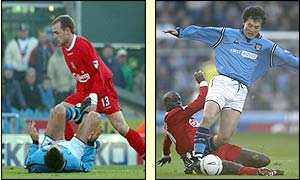 Liverpool's Danny Murphy battles with Kevin Horlock and Djimi Traore tackles Man City's Sun Jihai