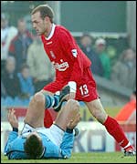 Liverpool's Danny Muprhy leaves City's Kevin Horlock flat on his back