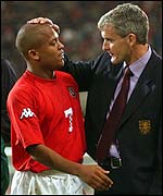 Mark Hughes congratulates Rob Earnshaw after he scores the winner against Germany