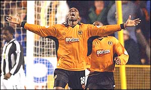 A delighted George Ndah celebrates having bundled the ball in from Lescott's header