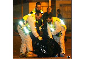 A special crew of orthodox Jewish emergency workers remove body parts from the scene 