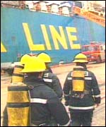 Firefighters at ship