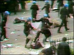 Photograph of police attacking demonstrators with batons