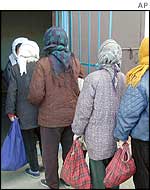North Korean women queue for food, Chongjin city, North Hamgyong province of North Korea, November 2002. 