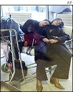 Passengers sleep at Charles De Gaulle airport